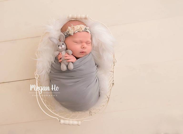 southern New Hampshire studio session newborn baby girl wrapped snuggling little bunny