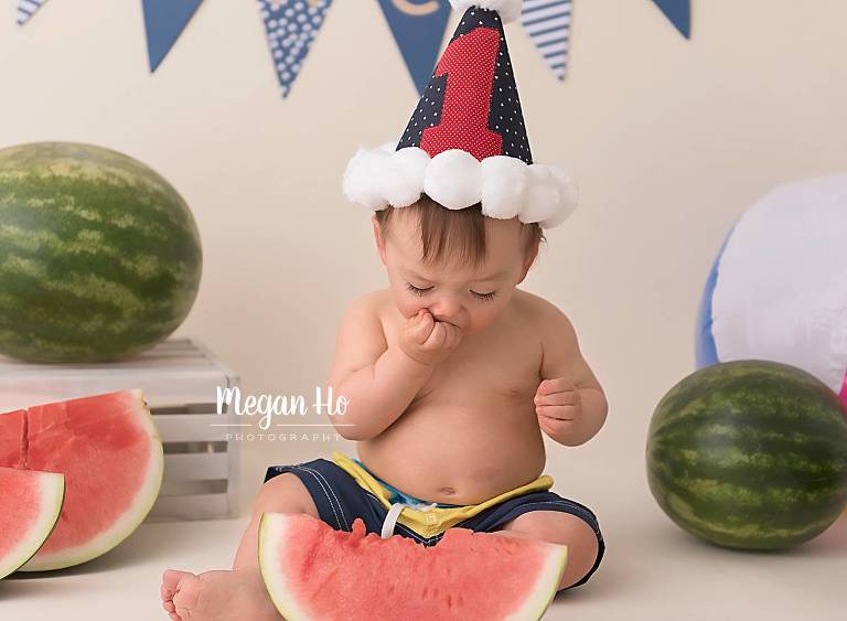 watermelon smash studio session for first birthday little boy in swimsuit