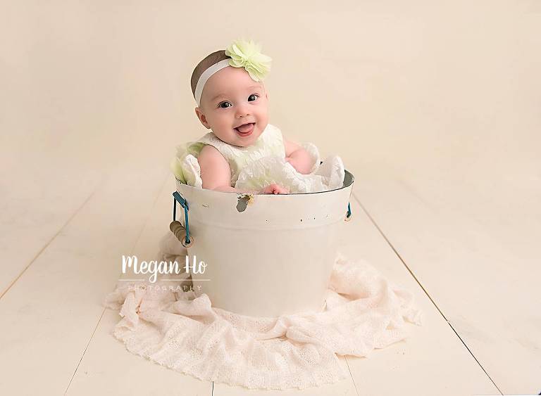 bedford nh milestone session smiling four month old in white bucket