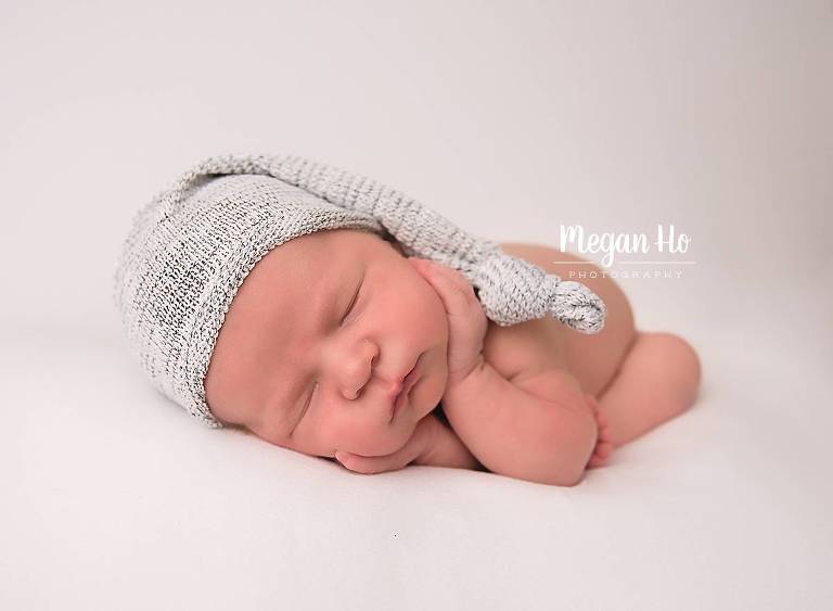 sleeping baby newborn boy in adorable hat in nh newborn session