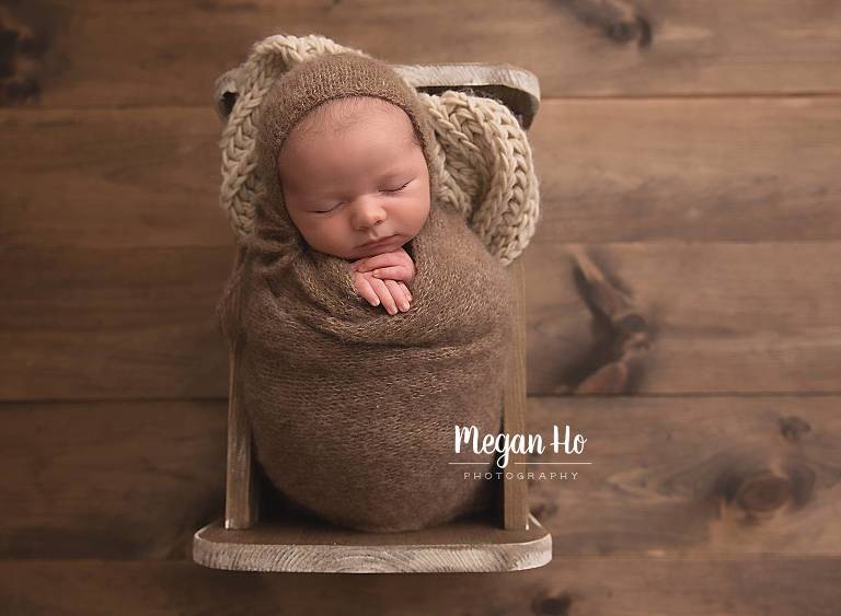 baby boy sleeping in little wooden bed southern nh newborn session