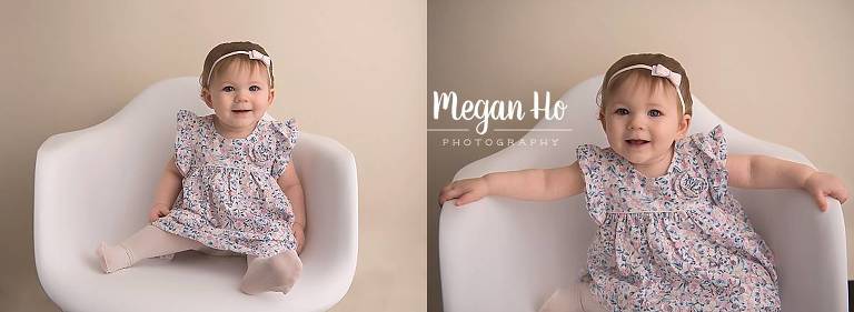 happy little one year girl in flower dress in white chair nh session