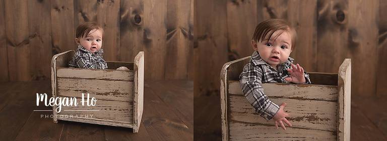 six month boy in plaid shirt sitting in little white bed in nh session