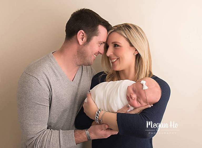 parents with newborn baby girl studio session bedford nh