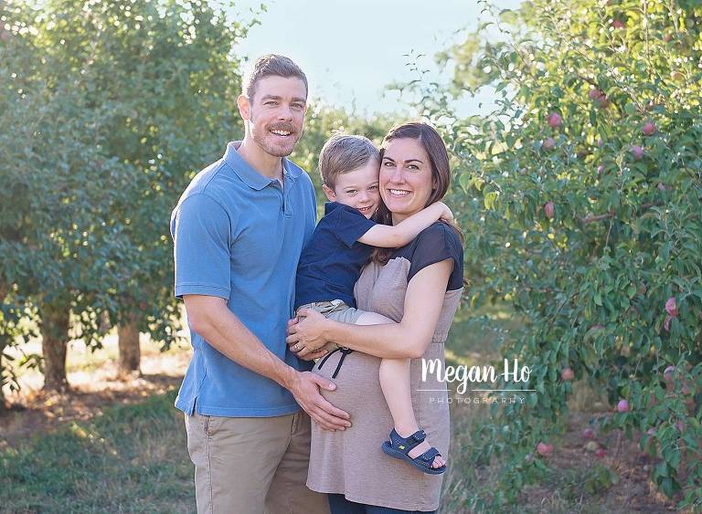 beautiful family with pregnant mom in nh apple orchard maternity session