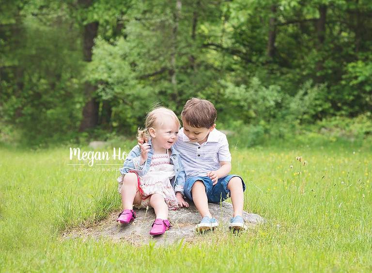 adorable kids sharing a secret in family session in Goffstown nh