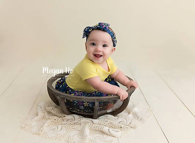 southern nh studio six month girl smiling in bowl with headband and dress