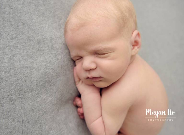 nh newborn studio session sleeping baby boy on gray