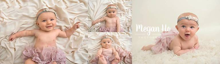 smiling little girl on white fabric in pink tutu for milestone session beford nh