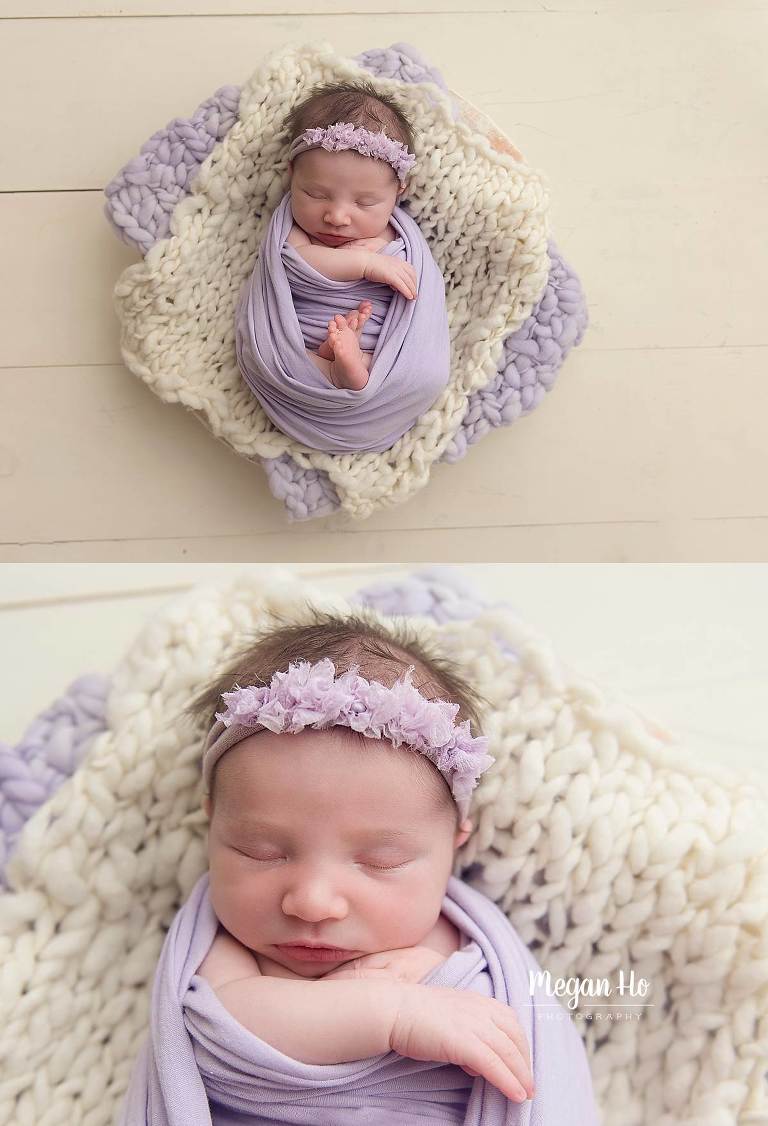 baby girl wrapped in light purple with headband sleeping on bump blankets on white wood
