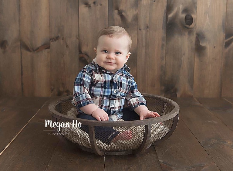 one year studio session blonde boy sitting in little wooden bowl