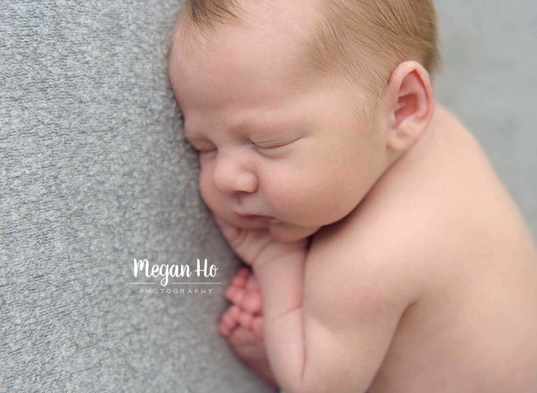 sweet baby cheeks and eyelashes in newborn session in nh studio