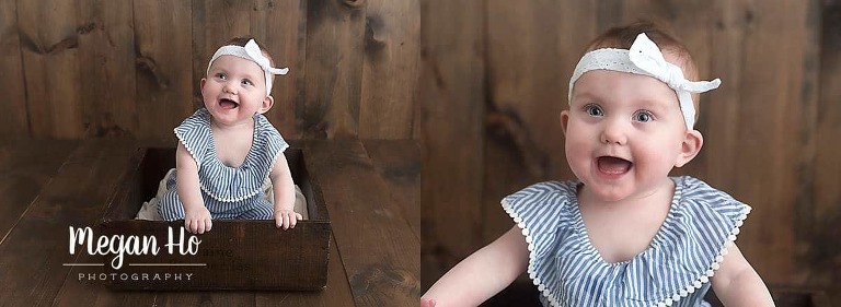 happy one year old girl in wooden crate in bedford nh