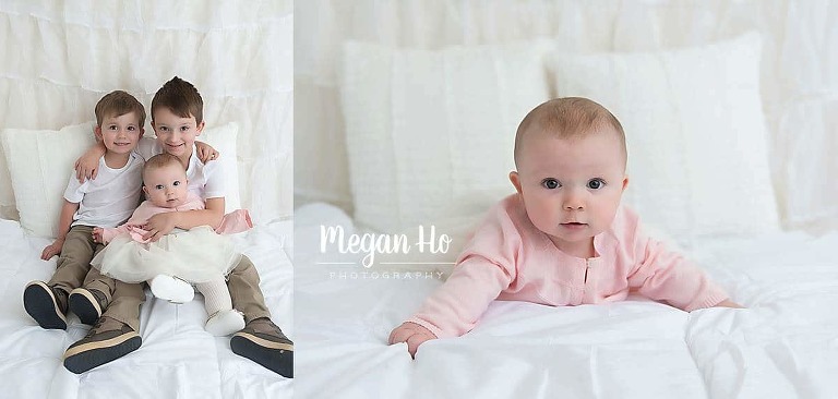 sweetest brothers and sister snuggling on white bed set up in bedford New Hampshire