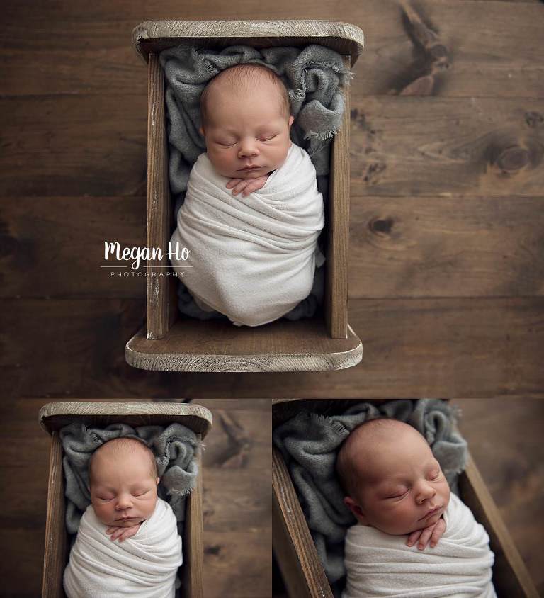 cute baby boy sleeping comfy in the cutest little wood bed in infant session