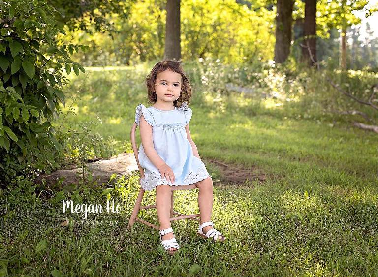 Londonderry nh two year old session girl in blue dress sitting on little chair