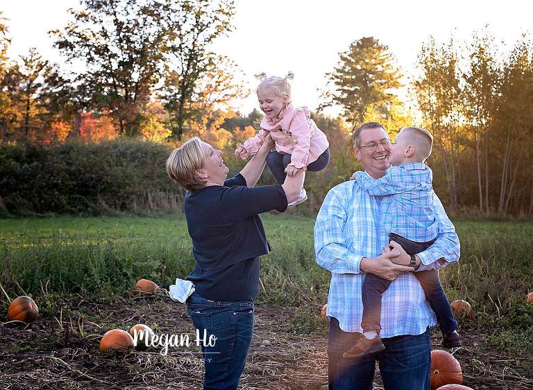 beautiful nh fall evening parents playing with their kids during session