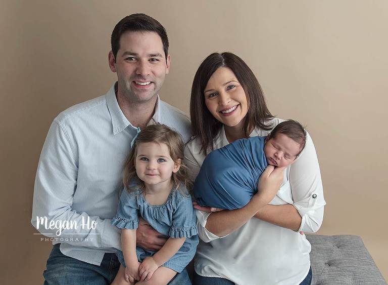 adorable new family of four in blue and white during nh newborn session