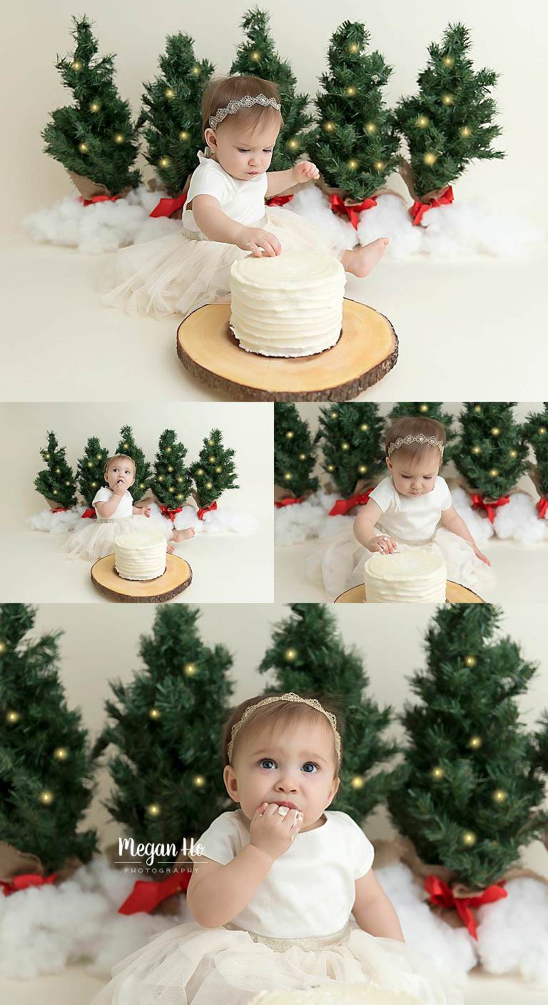 Christmas tree themed cakesmash little girl in white digging into cake