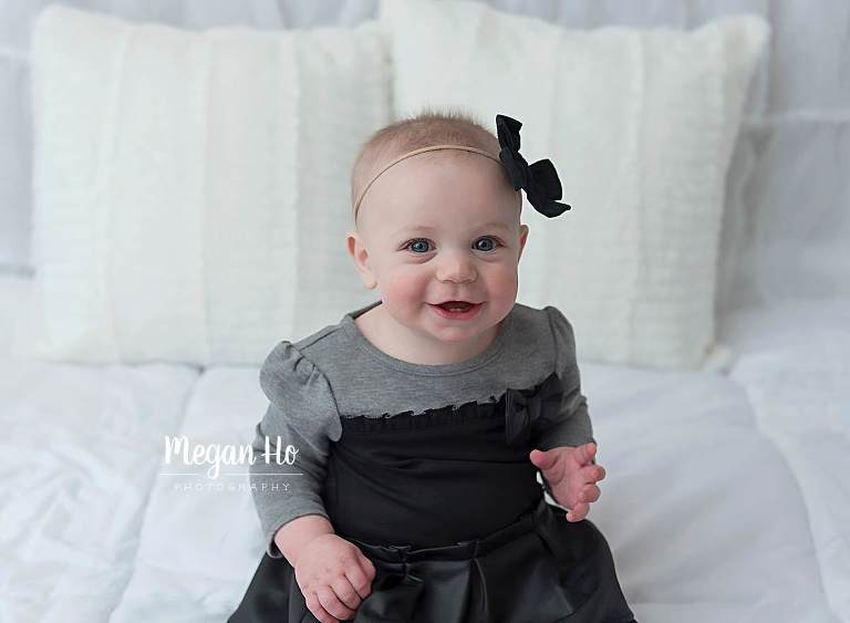 adorable smiling girl in black with bow in bedford nh studio
