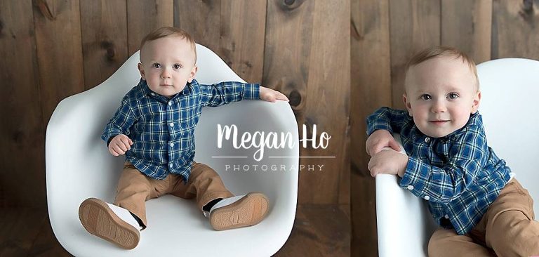 boy in blue plaid shirt on wooden backdrop sitting in white plastic chair