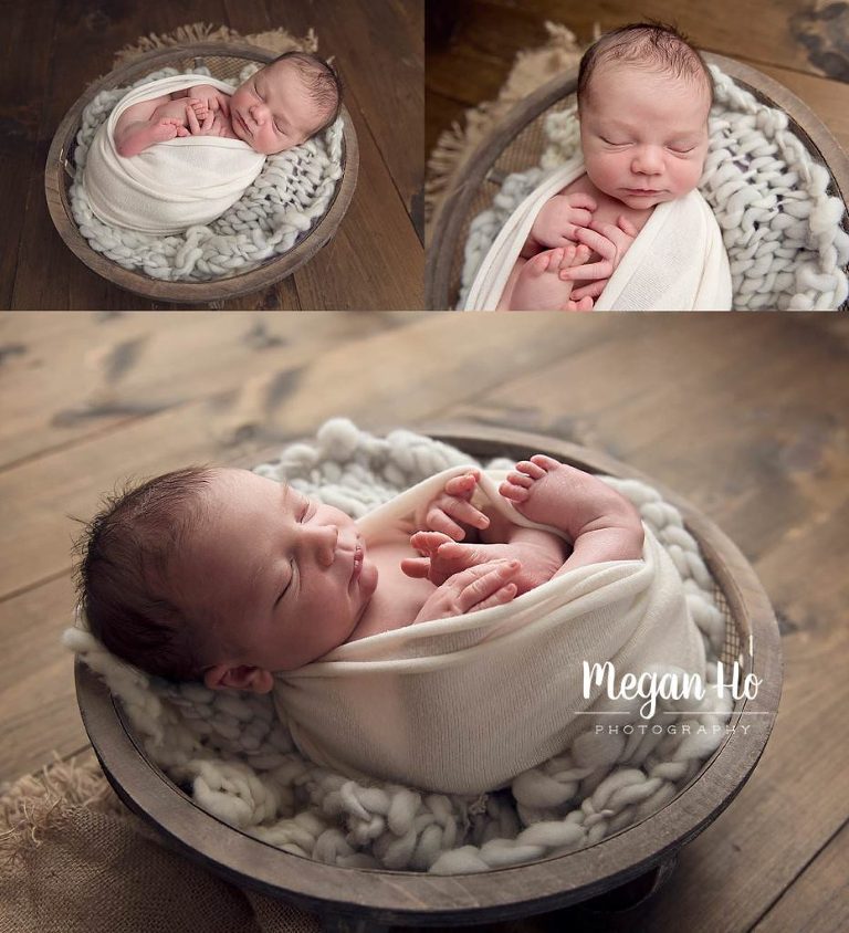 wrapped up sleeping little boy in wooden bowl
