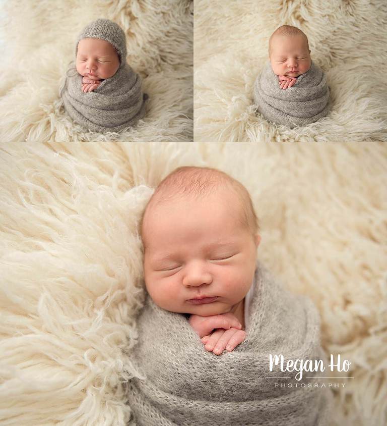 adorable wrapped baby boy in grey on fluffy cream blanket