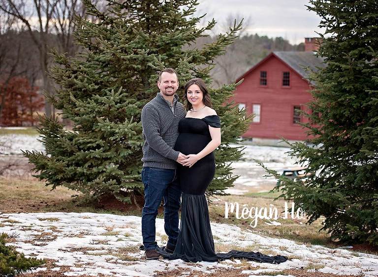 rustic maternity session black dress in snow