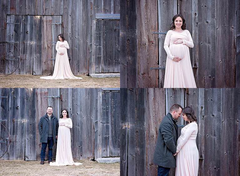 mom and dad to be pose in front of grey barn in a cream dress