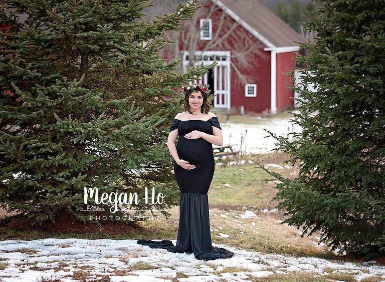 beautiful winter nh maternity session in black dress with flowers